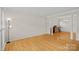 Spacious living room featuring hardwood floors and a formal dining area at 3830 Waters Reach Ln, Indian Trail, NC 28079