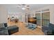 This living room offers hardwood floors, many windows, and an open floor plan to the kitchen at 3830 Waters Reach Ln, Indian Trail, NC 28079