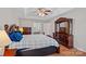 Main bedroom boasts beautiful wooden furniture, a ceiling fan, and plenty of space at 3830 Waters Reach Ln, Indian Trail, NC 28079