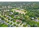 Overhead view of the neighborhood displaying tree lined streets and lush green spaces at 3830 Waters Reach Ln, Indian Trail, NC 28079