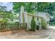 Cozy backyard with a wooden fence and mature trees at 4014 Sulkirk Rd, Charlotte, NC 28210