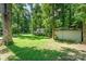 Large backyard featuring a shed and grass at 4014 Sulkirk Rd, Charlotte, NC 28210