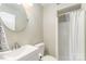 Clean bathroom featuring a sink, toilet, and shower at 4014 Sulkirk Rd, Charlotte, NC 28210