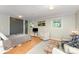 Cozy bedroom featuring hardwood floors, comfortable seating, and modern fixtures at 4014 Sulkirk Rd, Charlotte, NC 28210