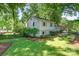Charming two-story home with a well-maintained lawn and landscaping at 4014 Sulkirk Rd, Charlotte, NC 28210