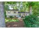 Charming home with a well-maintained lawn, mature trees, and inviting front entrance at 4014 Sulkirk Rd, Charlotte, NC 28210