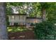 Charming home with a well-maintained lawn, mature trees, and inviting front entrance at 4014 Sulkirk Rd, Charlotte, NC 28210