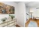 Inviting hallway with modern decor, leading to a staircase and well-lit living spaces at 4014 Sulkirk Rd, Charlotte, NC 28210