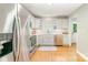 Well-lit kitchen features stainless steel appliances, white cabinets, and plenty of counter space at 4014 Sulkirk Rd, Charlotte, NC 28210