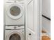 Efficient laundry area with stacked Samsung washer and dryer, maximizing space and convenience at 4014 Sulkirk Rd, Charlotte, NC 28210