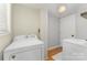 Functional laundry room with a washing machine and a dryer at 4014 Sulkirk Rd, Charlotte, NC 28210