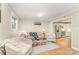 Bright living room featuring hardwood floors, comfortable seating, and an open floor plan into the kitchen at 4014 Sulkirk Rd, Charlotte, NC 28210