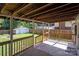 Covered porch overlooks the backyard with storage building at 405 E 18Th St, Kannapolis, NC 28083