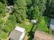 Aerial shot of the backyard featuring a fire pit area, shed, and lush lawn, perfect for outdoor entertaining at 405 E 18Th St, Kannapolis, NC 28083