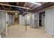 Spacious unfinished basement with exposed ceiling, concrete floor, and ample space for storage or future build-out at 405 E 18Th St, Kannapolis, NC 28083
