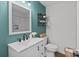 Renovated bathroom features modern vanity and updated fixtures at 405 E 18Th St, Kannapolis, NC 28083