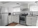 Bright kitchen features stainless steel appliances, subway tile backsplash and granite countertops at 405 E 18Th St, Kannapolis, NC 28083