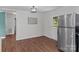 Eat-in kitchen with stainless steel refrigerator and view to the backyard at 405 E 18Th St, Kannapolis, NC 28083