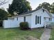 Back view of house featuring fenced backyard and walkway to the left side of the home at 407 W Mill St, Landis, NC 28088