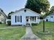 Charming single-story home featuring a well-maintained lawn and inviting front porch at 407 W Mill St, Landis, NC 28088