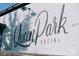 The Queen Park Social sign is on a white brick wall in a nice font at 411 Devender Ne Ln # 5, Charlotte, NC 28217