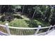 Tranquil backyard with lush greenery, as seen from the deck, offering a private outdoor retreat at 5322 Bridgeview Dr, Iron Station, NC 28080