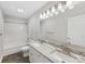 Bright bathroom with double sinks and granite countertops at 5322 Bridgeview Dr, Iron Station, NC 28080