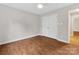 This bedroom features wood flooring and closet storage at 5322 Bridgeview Dr, Iron Station, NC 28080