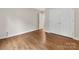 This bedroom features wood flooring and closet storage at 5322 Bridgeview Dr, Iron Station, NC 28080