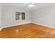 Sunlit bedroom with hardwood flooring, offering a calming and inviting space at 5322 Bridgeview Dr, Iron Station, NC 28080
