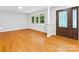 Bright entryway with hardwood floors, large window, and elegant front door at 5322 Bridgeview Dr, Iron Station, NC 28080