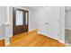 Entryway featuring hardwood floors, decorative front door, and a coat closet at 5322 Bridgeview Dr, Iron Station, NC 28080