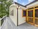 View of the home's screened porch and wood-grain exterior at 5322 Bridgeview Dr, Iron Station, NC 28080