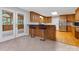 Modern kitchen featuring hardwood floors, stainless steel appliances, and breakfast bar with stool seating at 5322 Bridgeview Dr, Iron Station, NC 28080