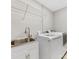 Laundry room with stainless steel sink and modern appliances at 5322 Bridgeview Dr, Iron Station, NC 28080
