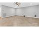 Spacious living room featuring neutral walls, tile floors, and ceiling fan at 5322 Bridgeview Dr, Iron Station, NC 28080