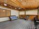 Relaxing outdoor patio with wood ceiling and comfortable seating at 5322 Bridgeview Dr, Iron Station, NC 28080