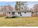 Exterior showcasing deck, large backyard, and back of the house at 5442 Kinsale Ln, Charlotte, NC 28215