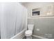 Cozy bathroom with shower, bathtub, and neutral tile at 5742 Murrayhill Rd, Charlotte, NC 28210