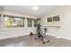 Bright exercise room features hardwood floors, natural lighting, and exercise equipment at 5742 Murrayhill Rd, Charlotte, NC 28210