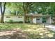 Beautiful single-story home with mature trees and a carport at 5742 Murrayhill Rd, Charlotte, NC 28210