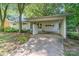 Beautiful single-story home with mature trees and a carport at 5742 Murrayhill Rd, Charlotte, NC 28210