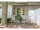 Inviting front porch with seating, white brick accents, and lush landscaping at 5742 Murrayhill Rd, Charlotte, NC 28210
