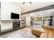 Bright living room features a fireplace with television and an open floor plan at 5742 Murrayhill Rd, Charlotte, NC 28210