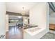 Bright living space with fireplace, seating area, dining area and hardwood floors at 5742 Murrayhill Rd, Charlotte, NC 28210