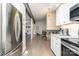 Open concept living space with hardwood floors and stylish lighting fixtures at 5742 Murrayhill Rd, Charlotte, NC 28210