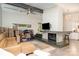 Open floor plan with a modern fireplace, comfortable seating, and bright, natural light at 5742 Murrayhill Rd, Charlotte, NC 28210