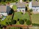Aerial view of a spacious fenced backyard with lush greenery and mature trees in a private setting at 6156 Kilchurn Dr, Fort Mill, SC 29707