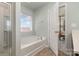Relax in this bright bathroom with a large tub and adjacent bedroom at 6156 Kilchurn Dr, Fort Mill, SC 29707