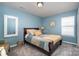 Relaxing bedroom with abundant natural light and a decorative mirror at 6156 Kilchurn Dr, Fort Mill, SC 29707